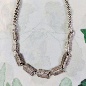 Silver Fossil Necklace with Arrow Feathers